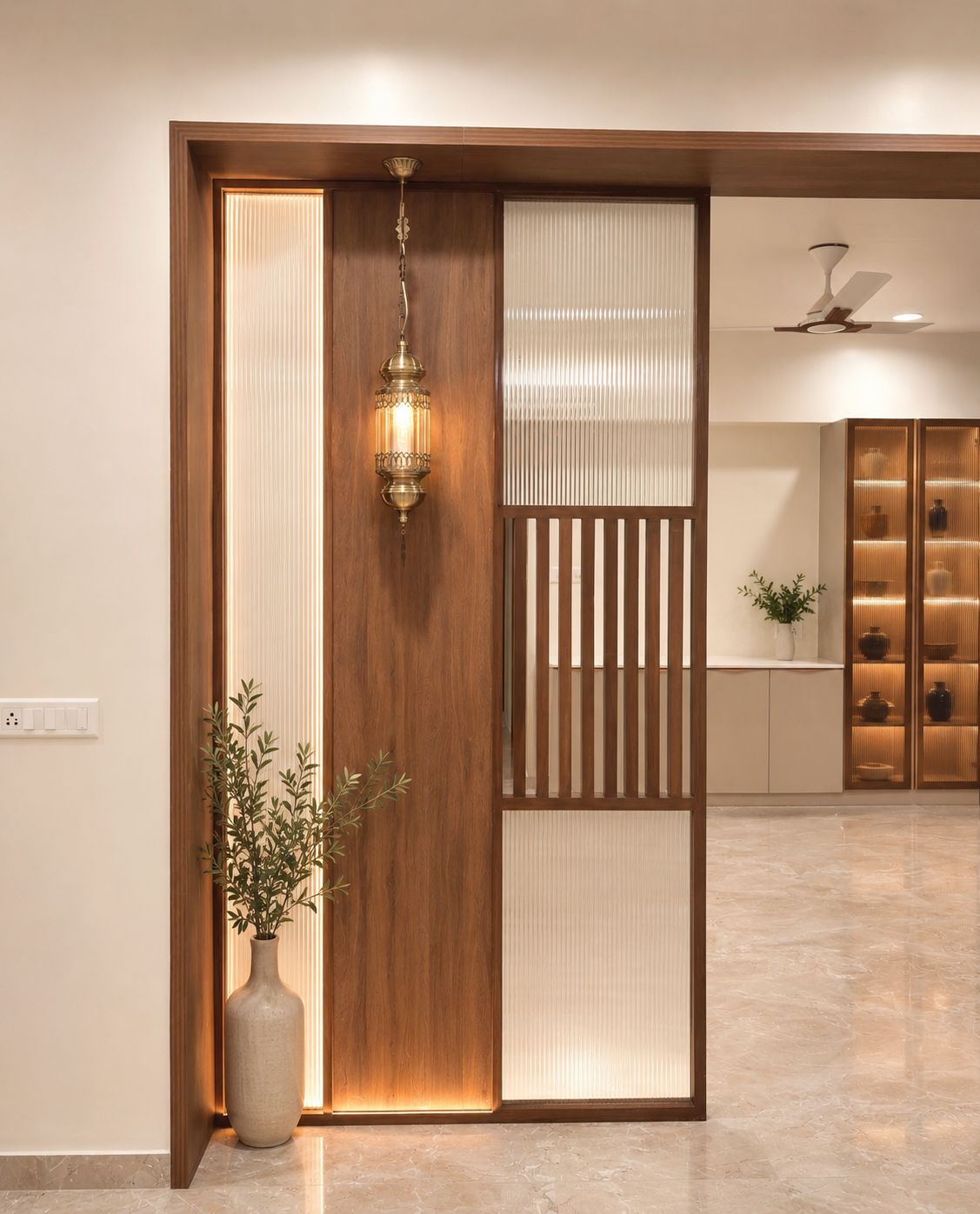 Entryway with slatted timber jaali partition and console at Begwani's Residence