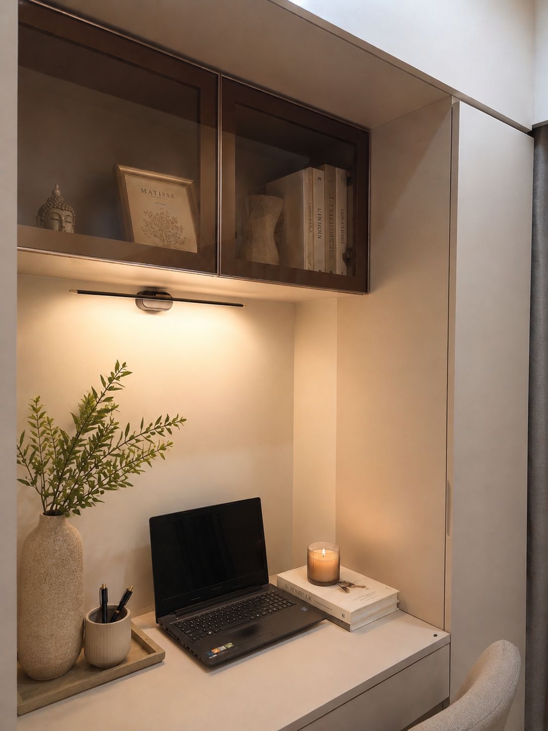 Compact study nook with built-in desk and open shelving