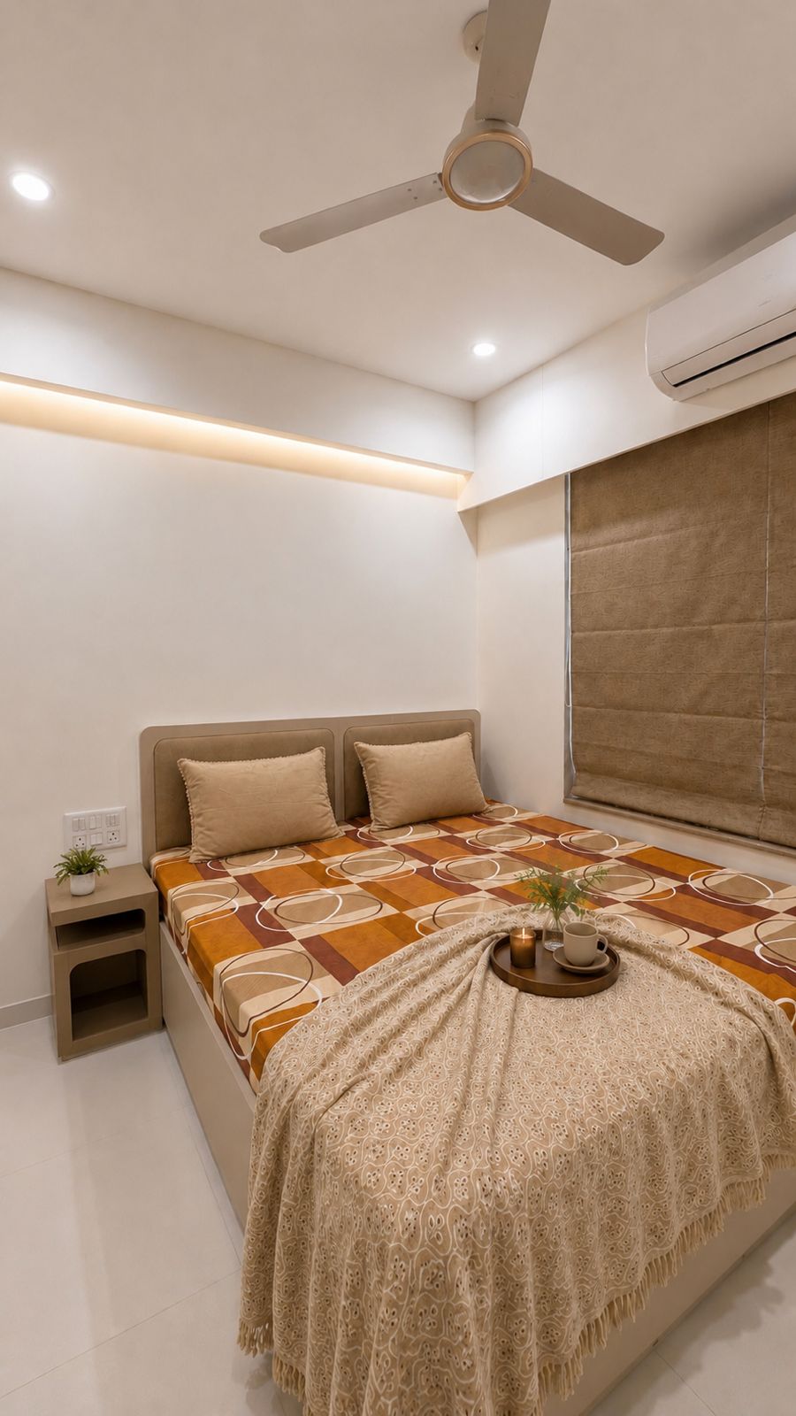 Bedroom with rust-orange runner over bed at Sipani House